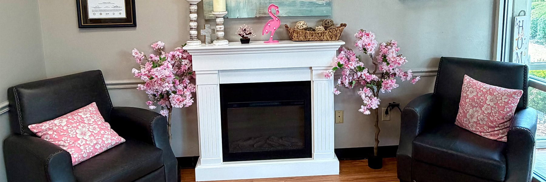 Fireplace and seating in front lobby at Cherrywood Post Acute